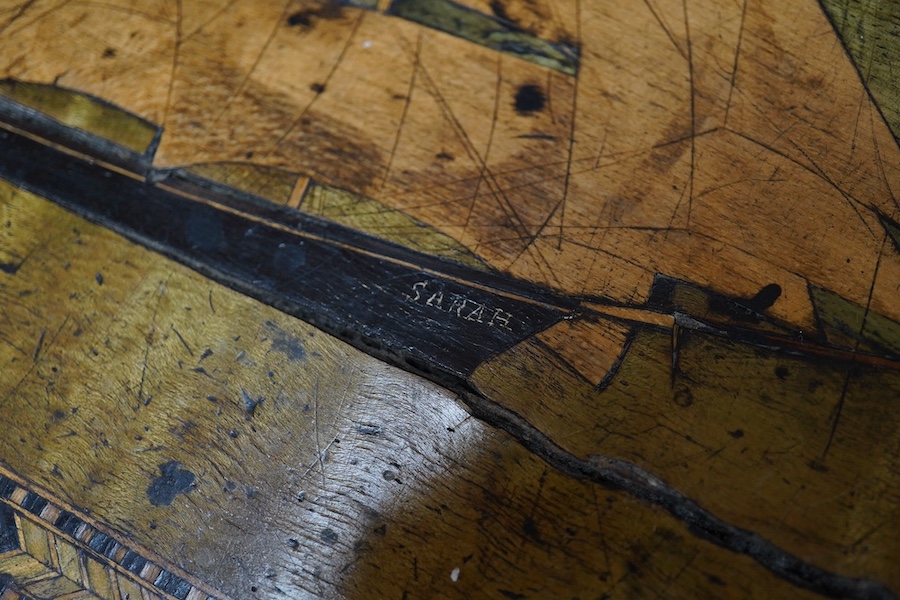 A Victorian writing slope, painted with a panel of a ship in full sail. 39cm wide x 17 cm high. Condition - top cracked